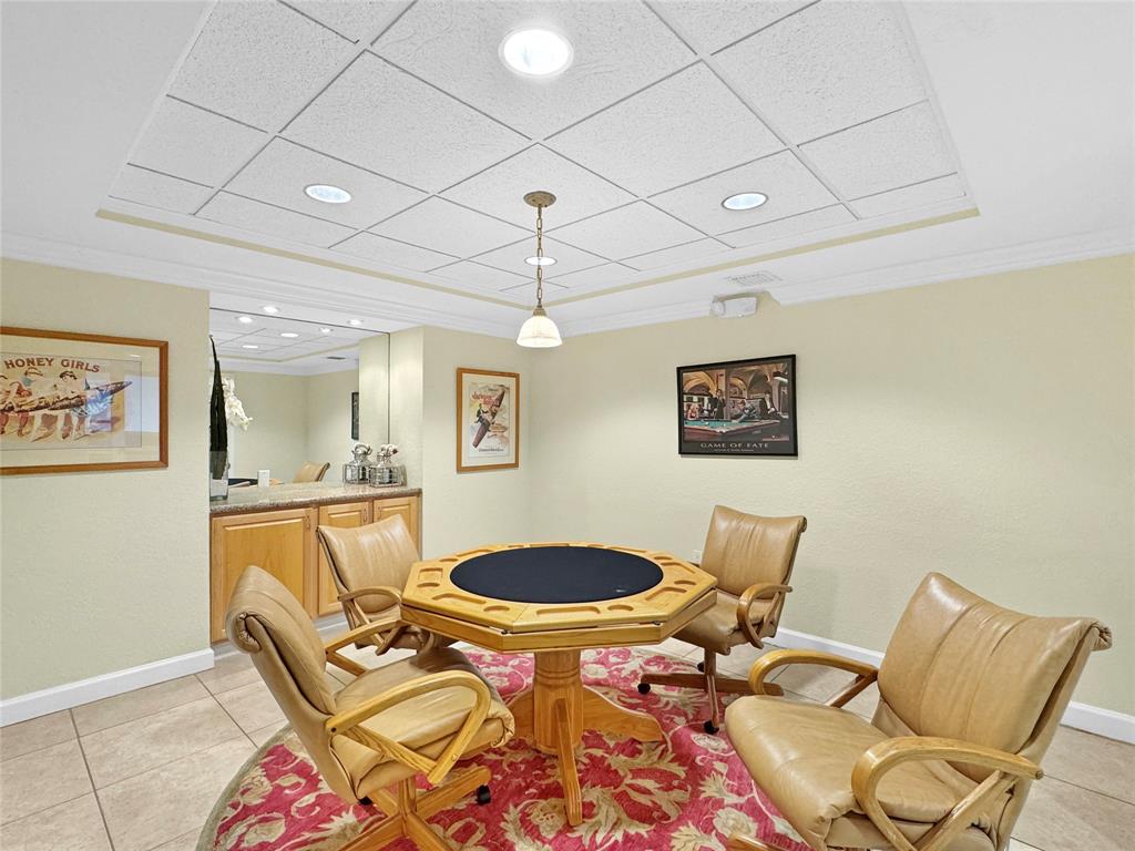 1515 East Broward Boulevard, Unit 107 Fort Lauderdale, FL 33301 - Photo 32 of 36 Cozy card room for poker nights, puzzles, or board game fun.