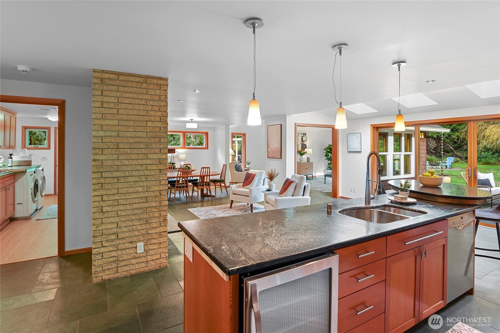 6133 Lariat Loop Bainbridge Island, WA 98110 - Photo 15 of 40 a kitchen with stainless steel appliances granite countertop a kitchen island a stove and a sink