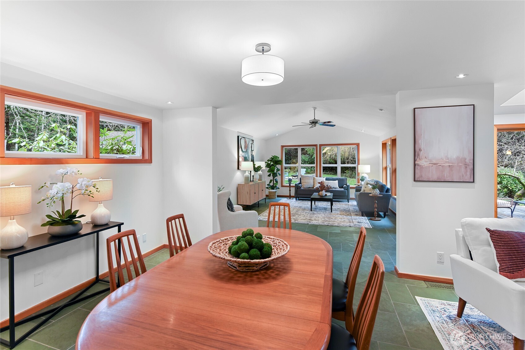6133 Lariat Loop Bainbridge Island, WA 98110 - Photo 19 of 40 a view of a dining room with furniture a chandelier and wooden floor