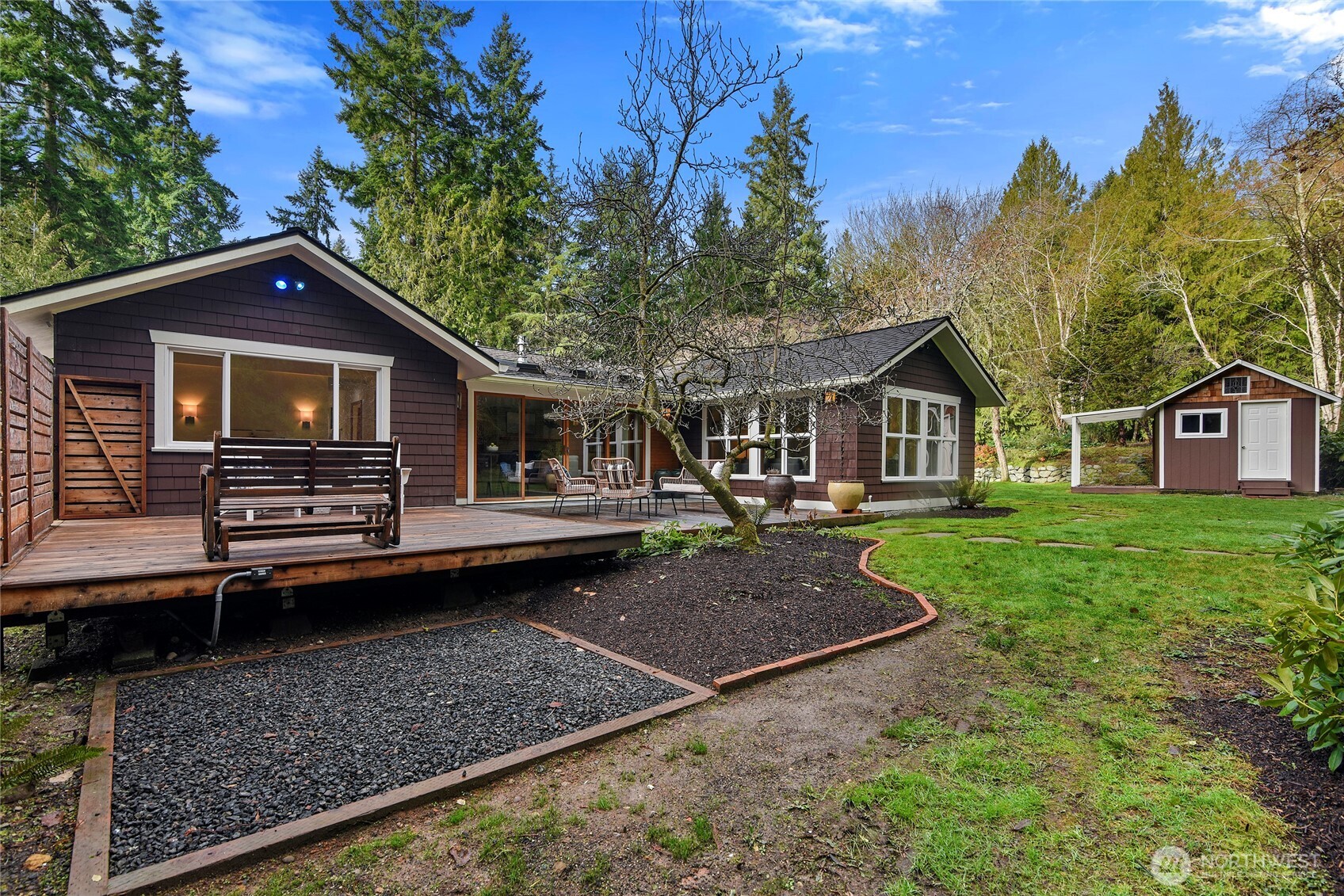 6133 Lariat Loop Bainbridge Island, WA 98110 - Photo 24 of 40 a front view of a house with garden