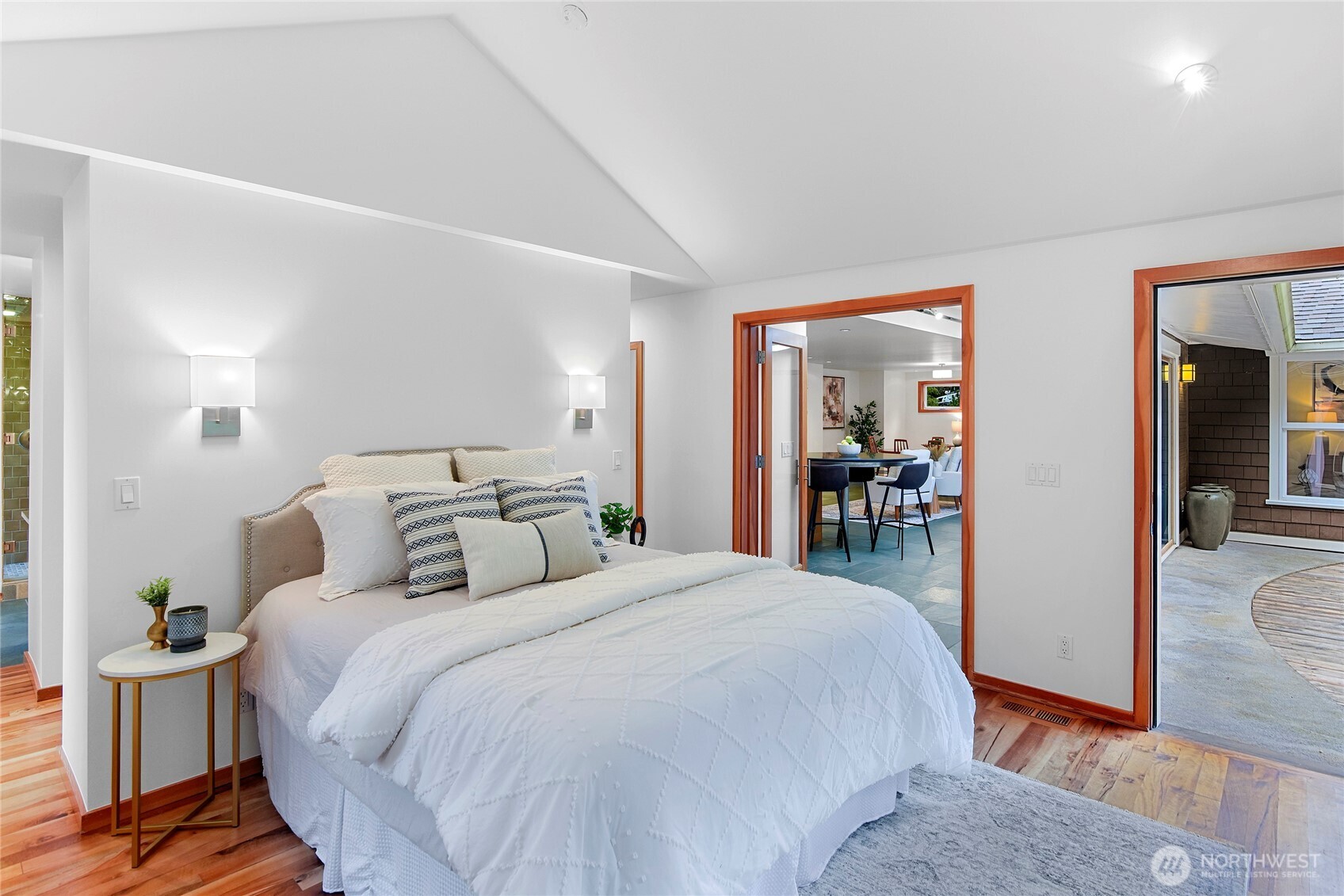 6133 Lariat Loop Bainbridge Island, WA 98110 - Photo 25 of 40 a bed room with a bed and a mirror