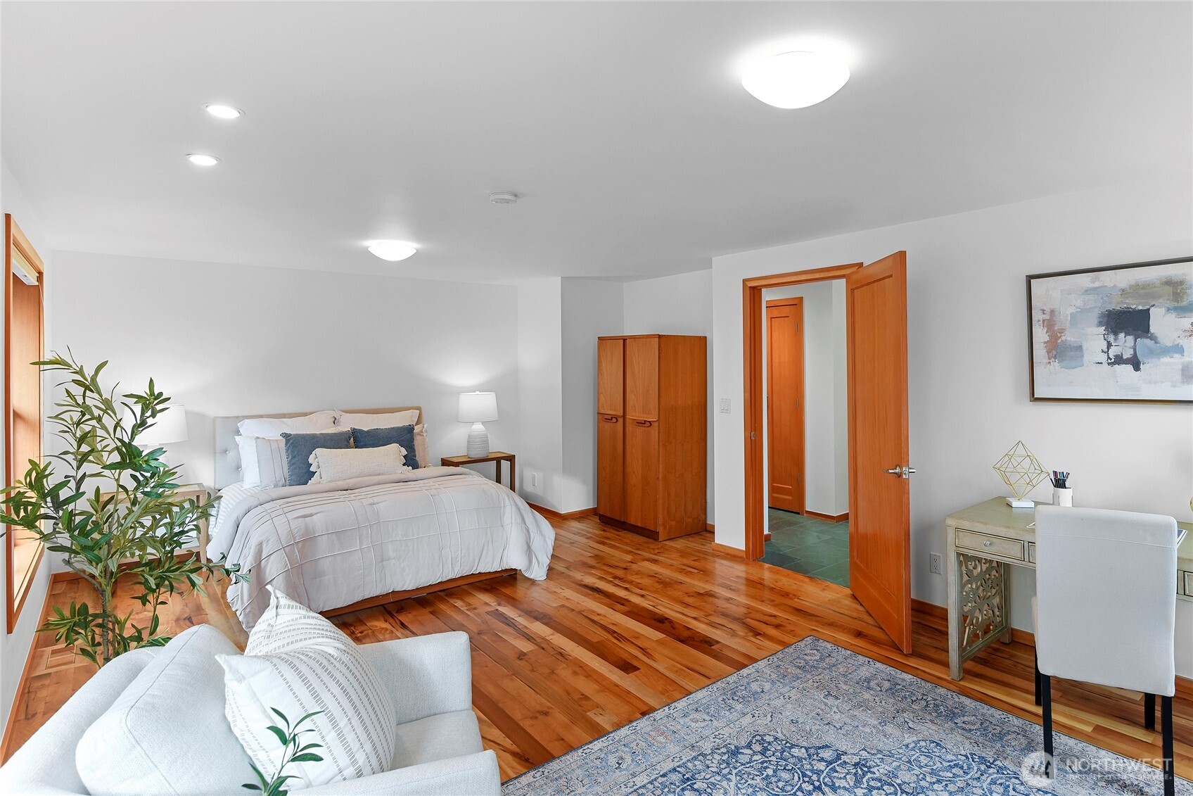 6133 Lariat Loop Bainbridge Island, WA 98110 - Photo 35 of 40 a bedroom with a bed and a lamp