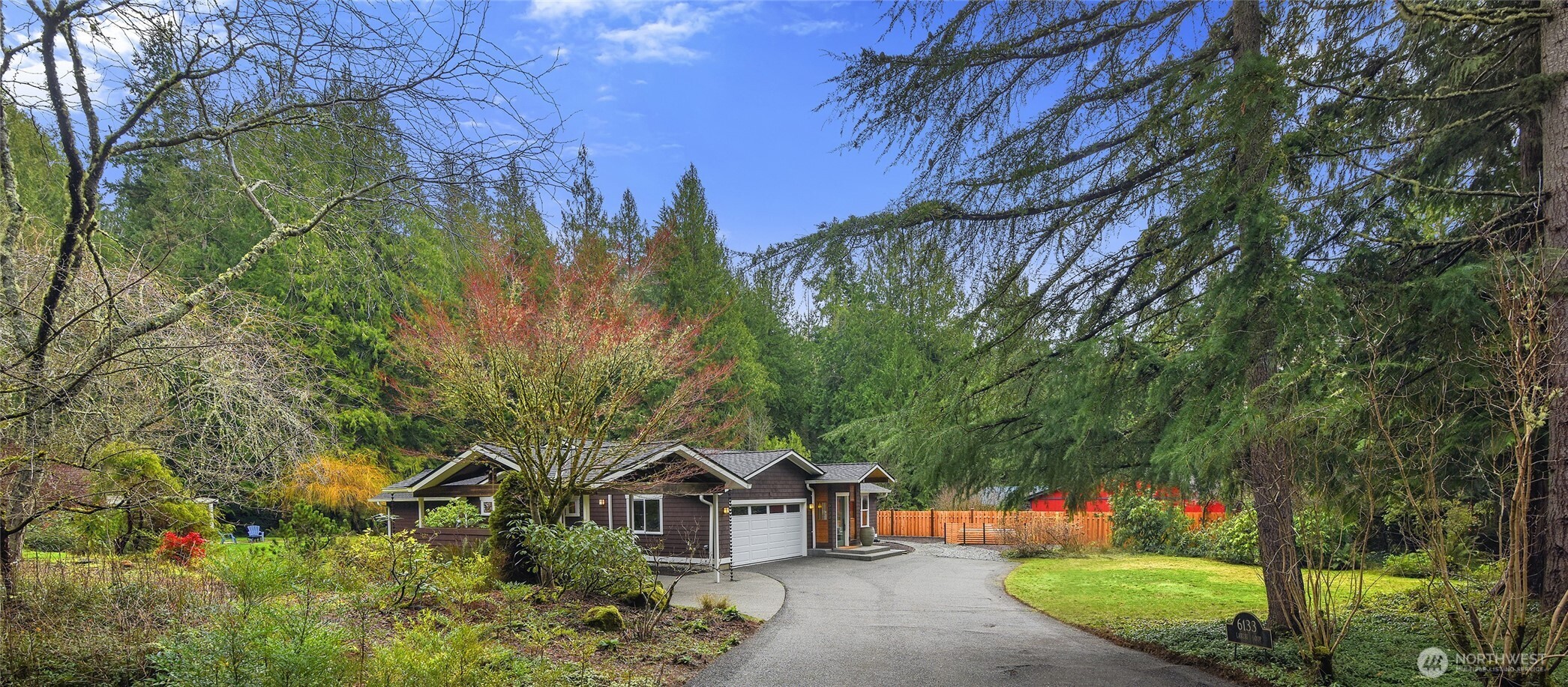 6133 Lariat Loop Bainbridge Island, WA 98110 - Photo 39 of 40 a view of a house with a yard and tree s