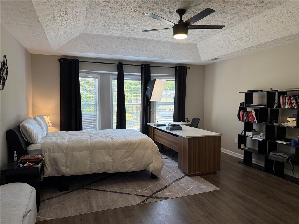 934 Bay Ridge Drive Lawrenceville, GA 30045 - Photo 60 of 78 a bedroom with a bed and a chandelier
