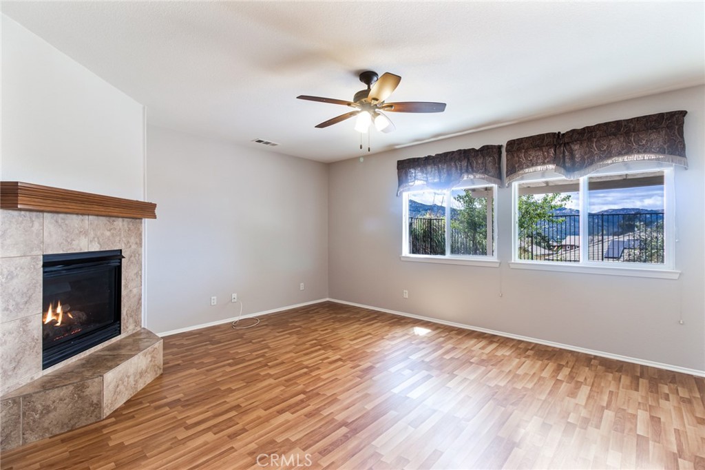 46321 Sharon Street Temecula, CA 92592 - Photo 19 of 40 a view of an empty room with wooden floor and a window