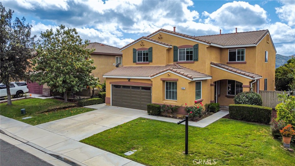 46321 Sharon Street Temecula, CA 92592 - Photo 2 of 40 a front view of a house with a yard