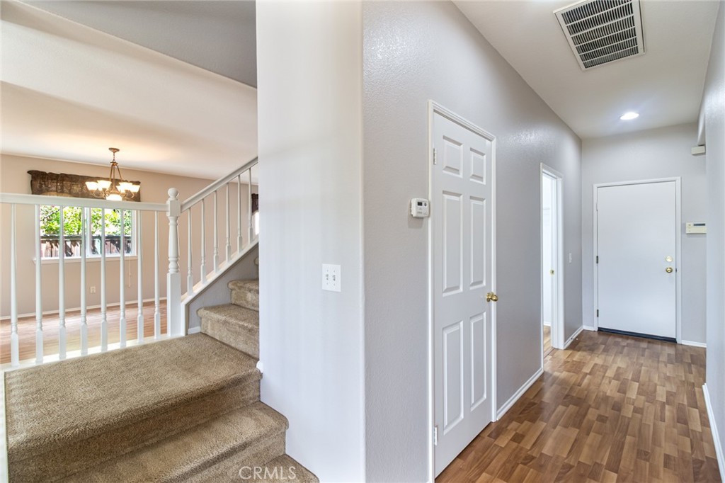 46321 Sharon Street Temecula, CA 92592 - Photo 22 of 40 a view of entryway with wooden floor