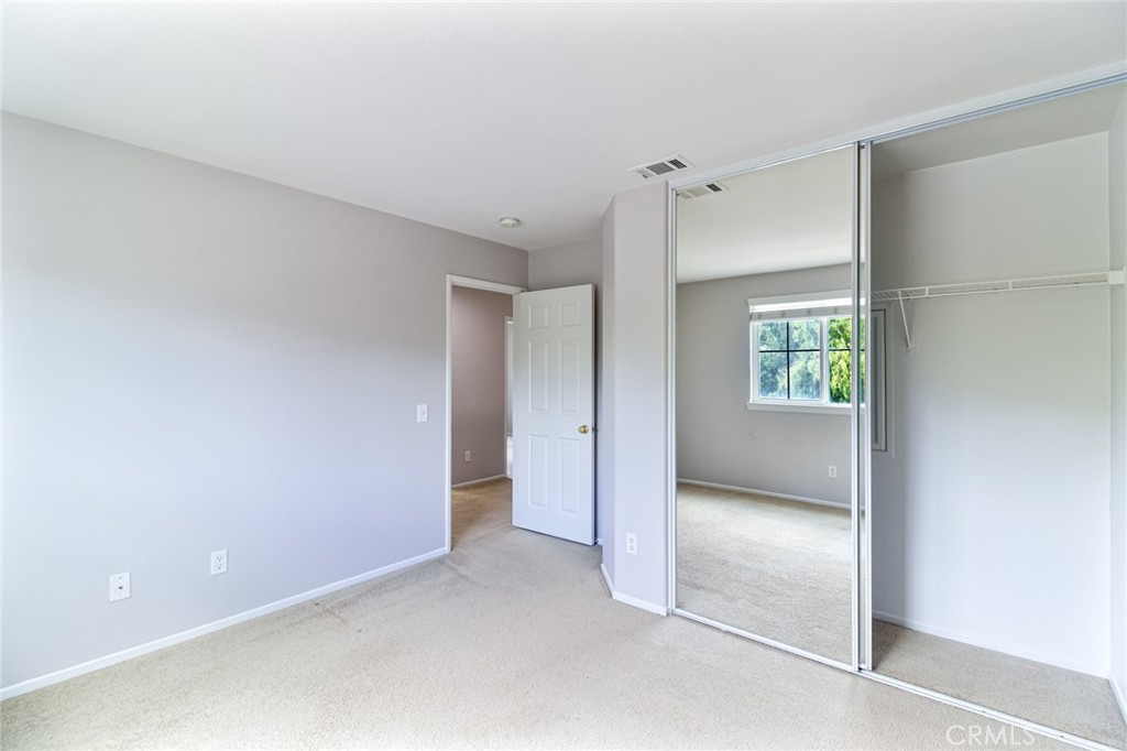 46321 Sharon Street Temecula, CA 92592 - Photo 26 of 40 an empty room with windows and closet
