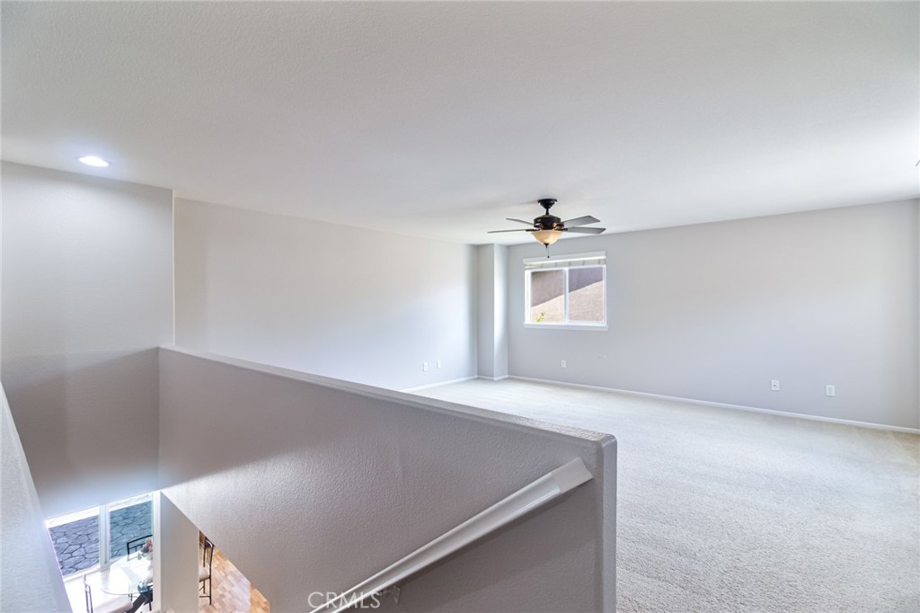 46321 Sharon Street Temecula, CA 92592 - Photo 30 of 40 an empty room with windows and white walls