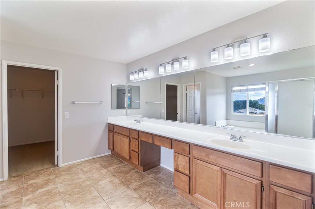 46321 Sharon Street Temecula, CA 92592 - Photo 34 of 40 a bathroom with a sink double vanity and a mirror