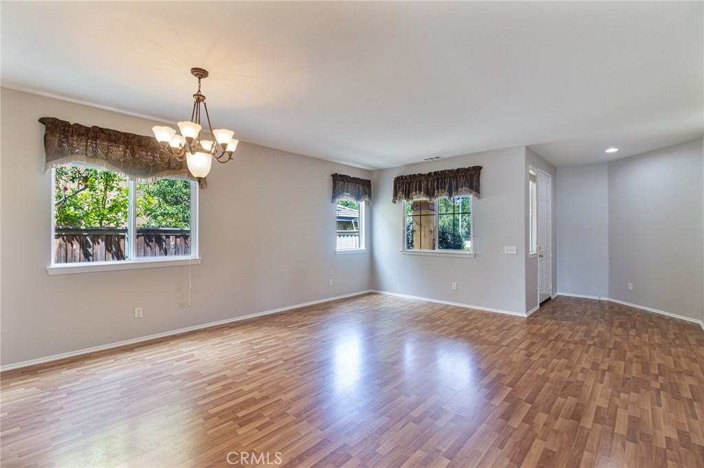 46321 Sharon Street Temecula, CA 92592 - Photo 10 of 40 a view of an empty room with window and wooden floor