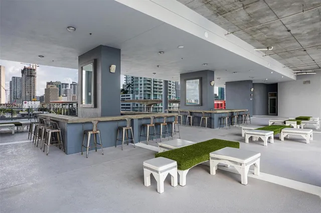a view of a patio with a table and chairs