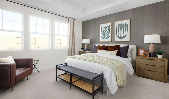 a bed room with a bed and a couch