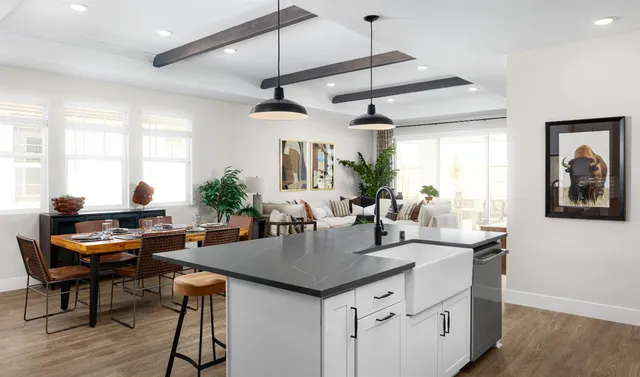 a dining room with furniture window and wooden floor
