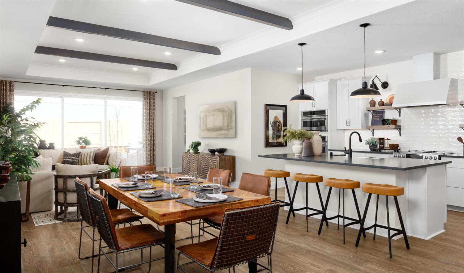 4452 Doric Way Rancho Cordova, CA 95742 - Photo 6 of 15 a dining room with stainless steel appliances kitchen island a table and chairs