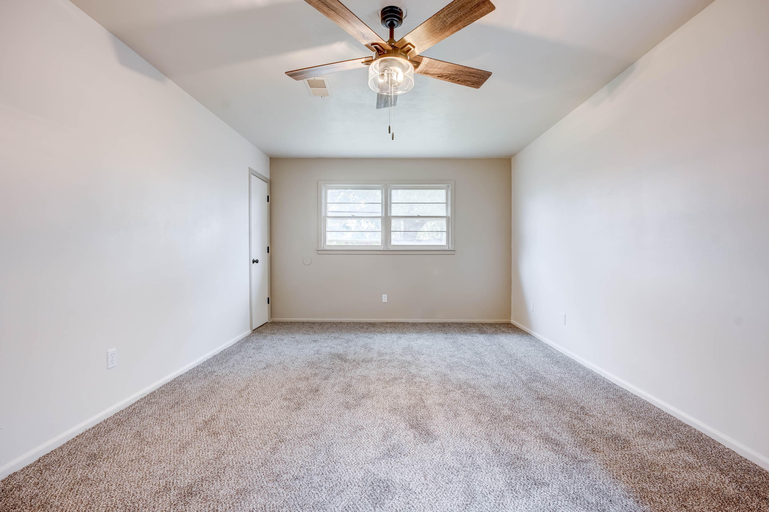 2101 64th Street Lubbock, TX 79412 - Photo 19 of 30 an empty room with windows and fan