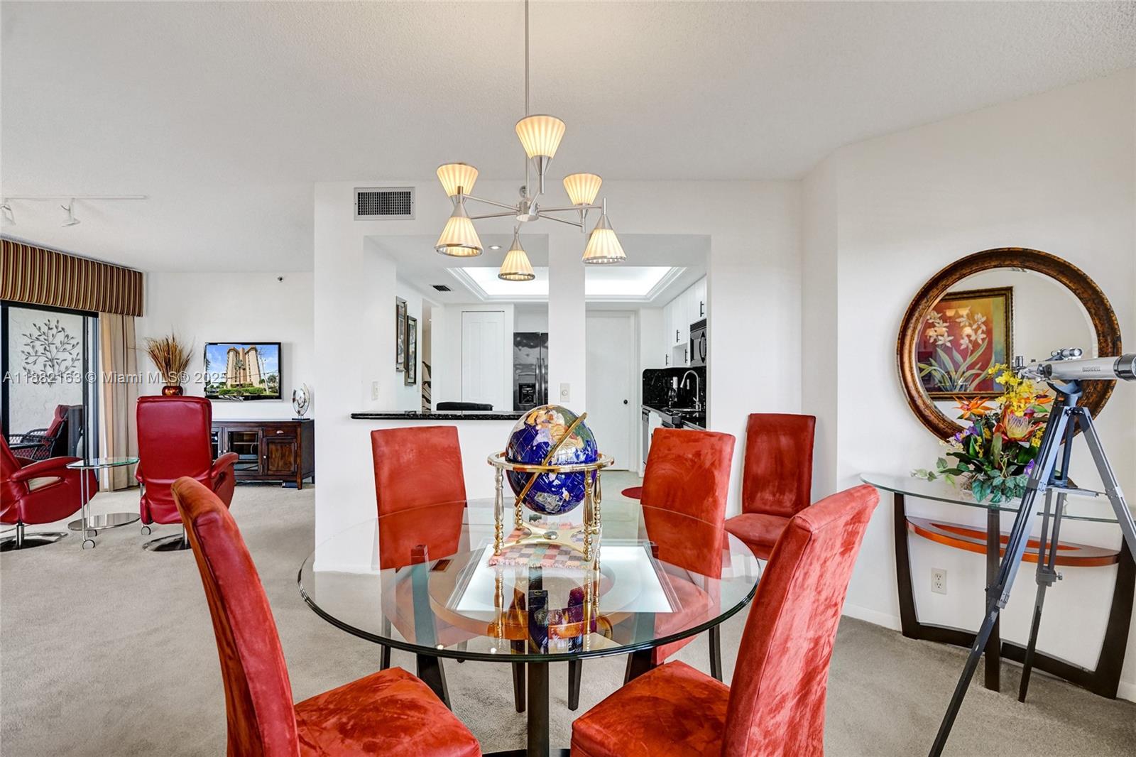 501 North Riverside Drive, Unit PH2 Pompano Beach, FL 33062 - Photo 12 of 80 a view of a dining room with furniture and a chandelier