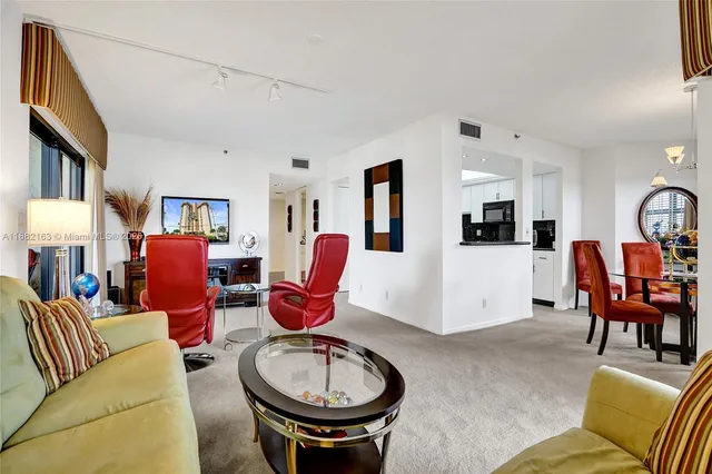 a room with furniture toys and a large window