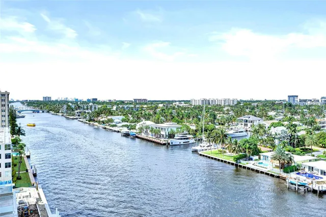 a living room with furniture a rug and a painting on the wall