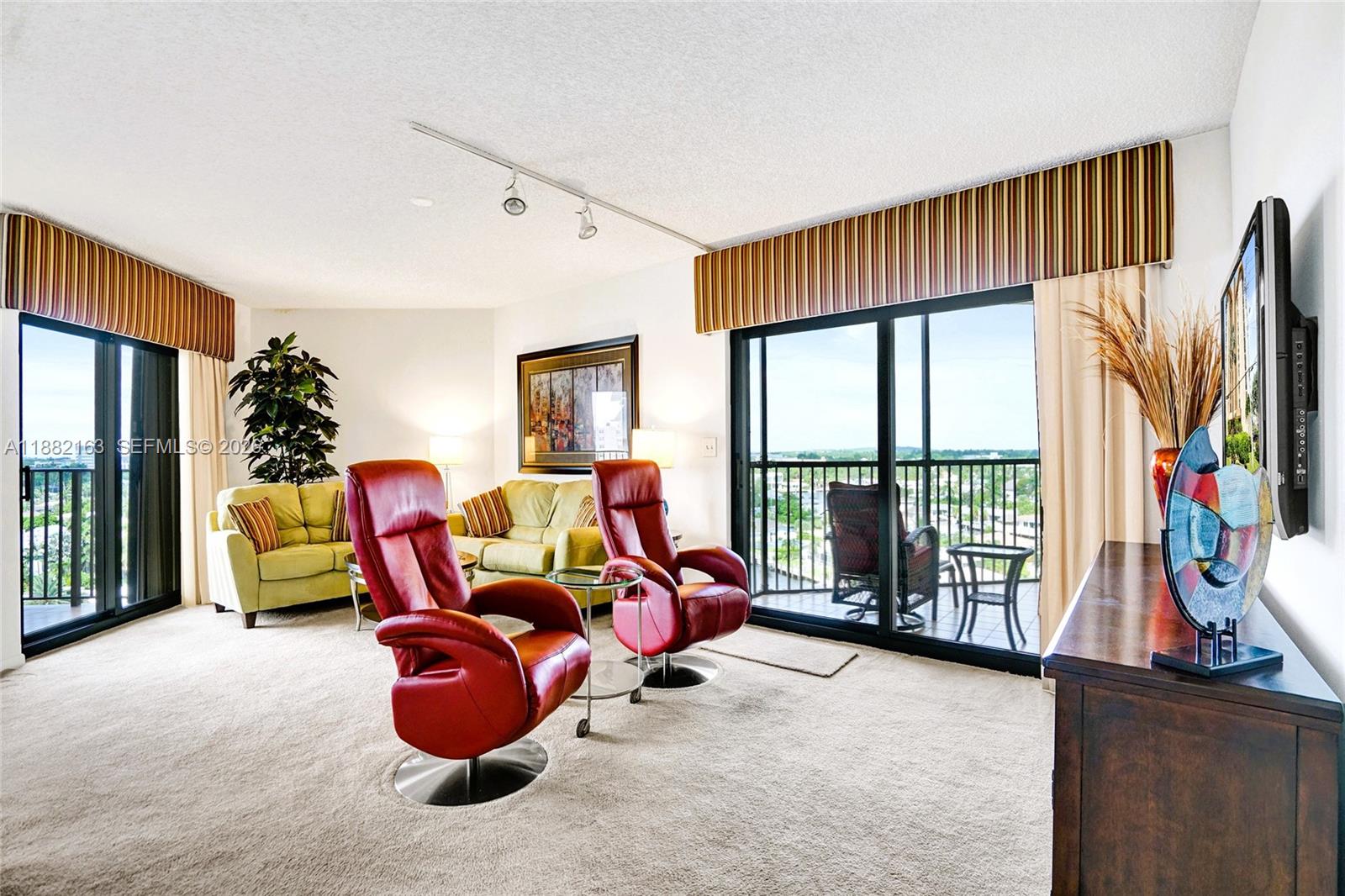 501 North Riverside Drive, Unit PH2 Pompano Beach, FL 33062 - Photo 21 of 83 a room with furniture toys and a large window