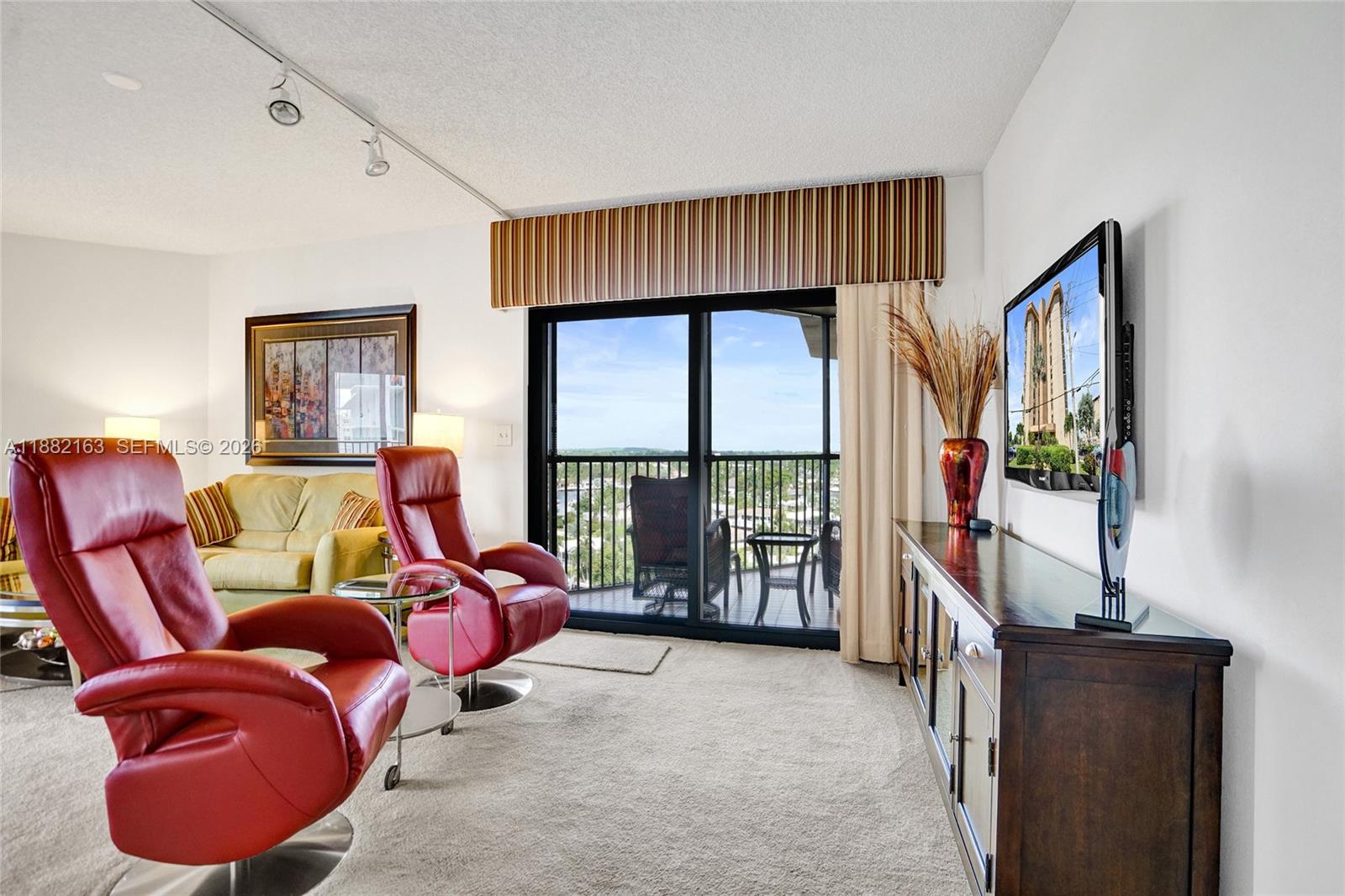 501 North Riverside Drive, Unit PH2 Pompano Beach, FL 33062 - Photo 29 of 83 a bedroom with furniture and a large window