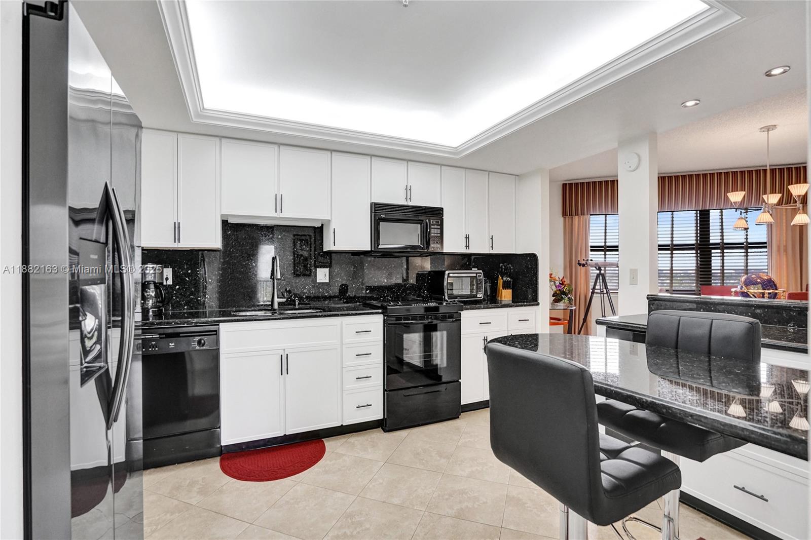 501 North Riverside Drive, Unit PH2 Pompano Beach, FL 33062 - Photo 3 of 80 a kitchen with stainless steel appliances granite countertop a stove top oven a sink and a refrigerator