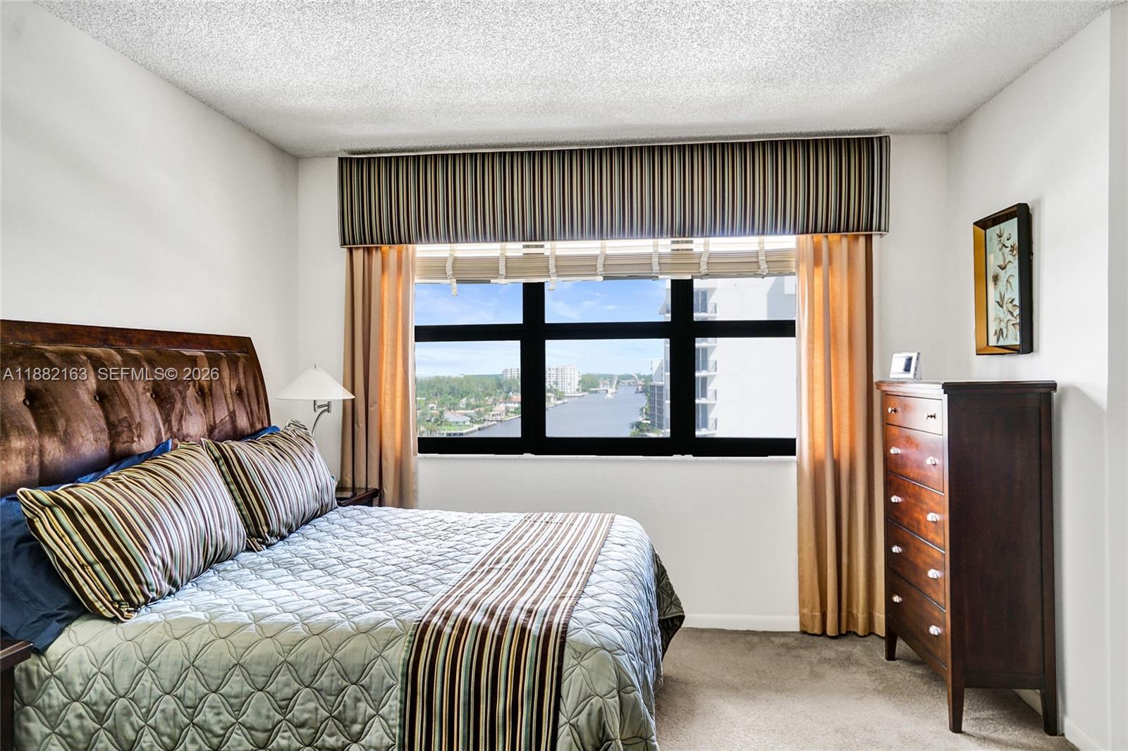 501 North Riverside Drive, Unit PH2 Pompano Beach, FL 33062 - Photo 35 of 83 a bedroom with a bed and window with large mirror