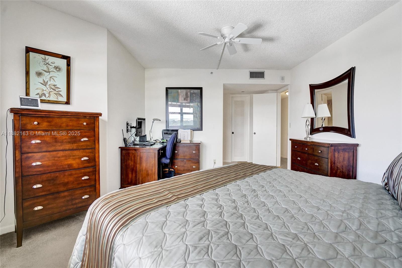 501 North Riverside Drive, Unit PH2 Pompano Beach, FL 33062 - Photo 36 of 80 a bedroom with a bed and a dresser