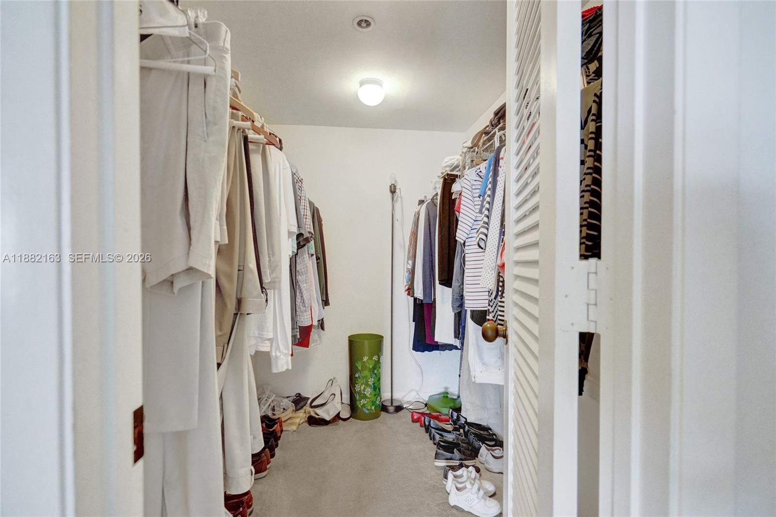501 North Riverside Drive, Unit PH2 Pompano Beach, FL 33062 - Photo 41 of 83 a view of walk in closet with clothes and shoes