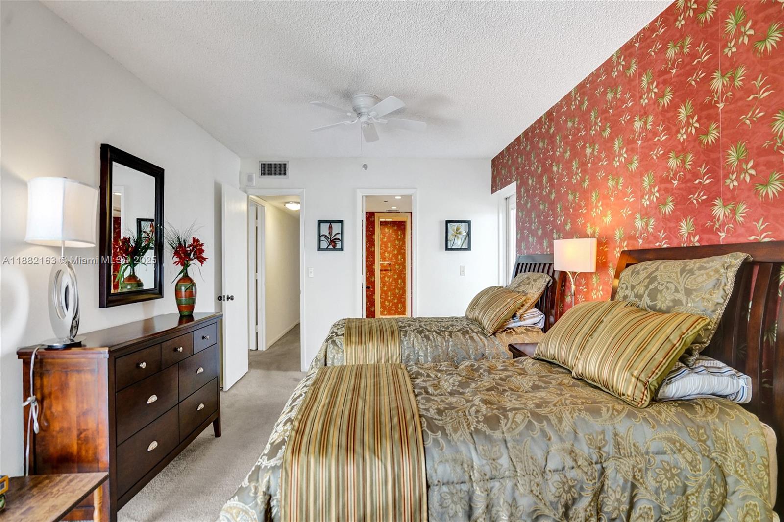 501 North Riverside Drive, Unit PH2 Pompano Beach, FL 33062 - Photo 46 of 80 a bedroom with a bed and a dresser