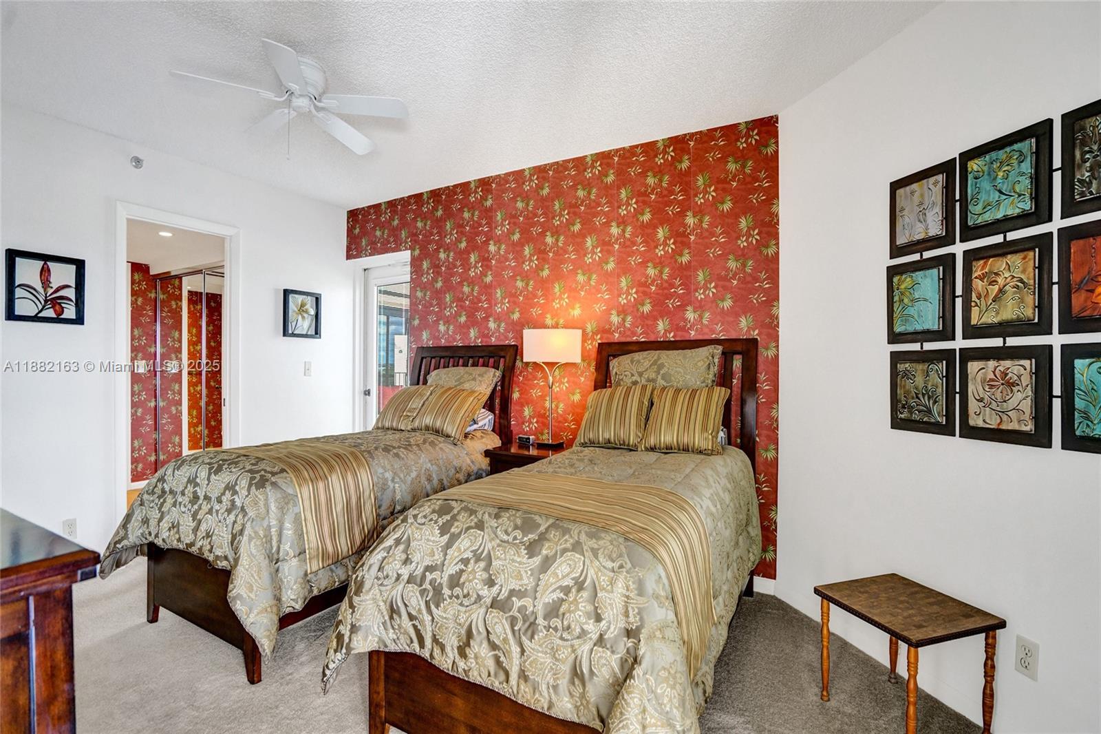 501 North Riverside Drive, Unit PH2 Pompano Beach, FL 33062 - Photo 47 of 80 a bedroom with two beds and painting on the wall