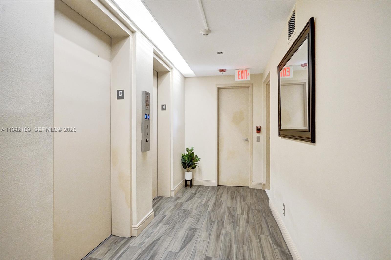 501 North Riverside Drive, Unit PH2 Pompano Beach, FL 33062 - Photo 60 of 83 a view of a hallway with wooden floor and closet
