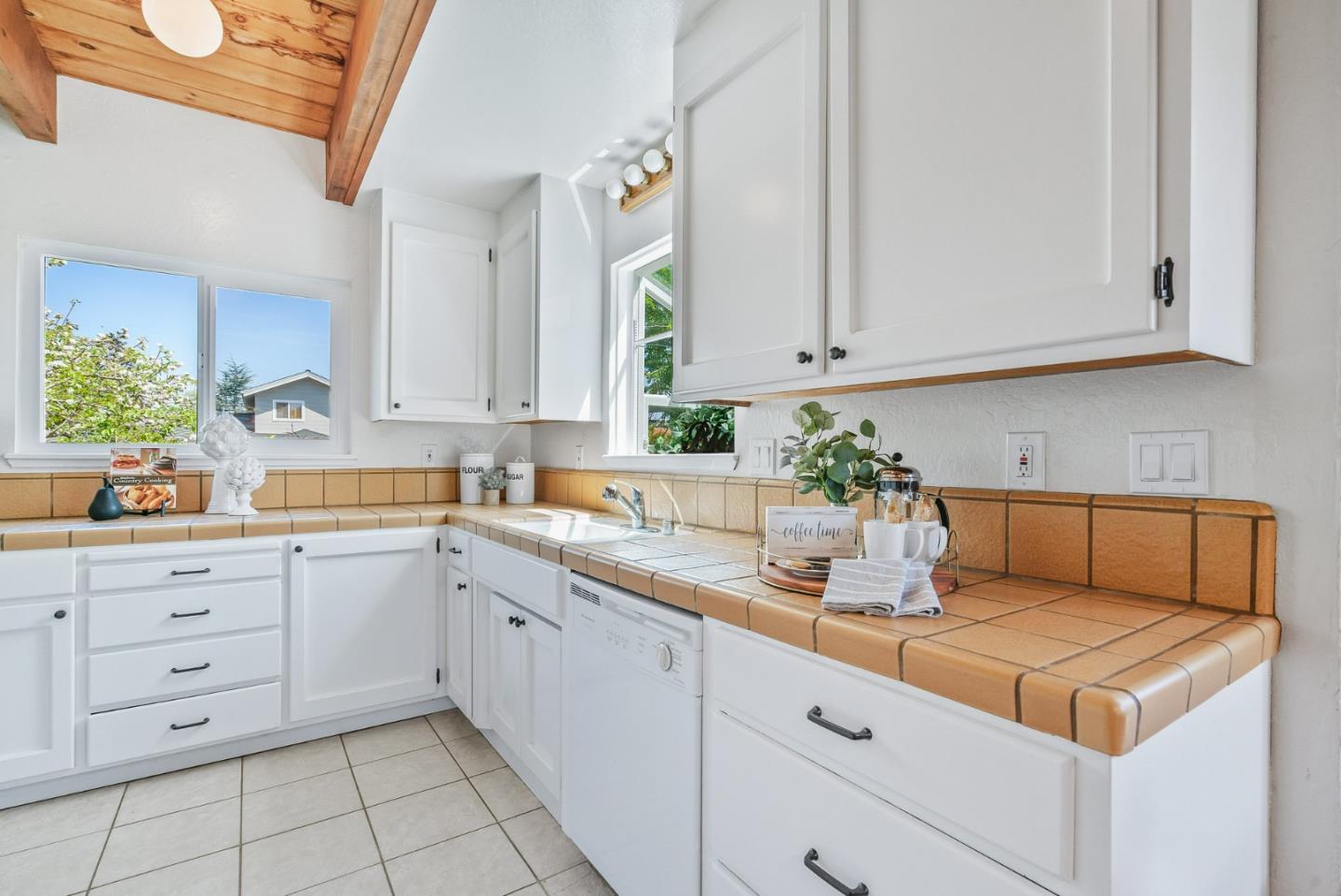620 Sumner Street Santa Cruz, CA 95062 - Photo 15 of 45 a kitchen with cabinets appliances a sink and a window