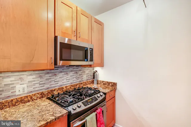 a kitchen with a stove and a microwave