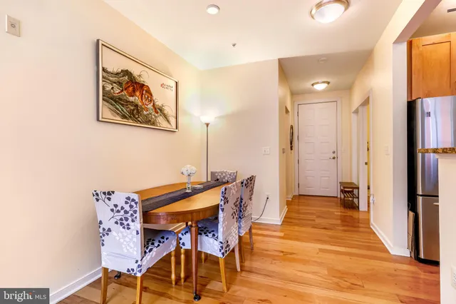 a view of a room with furniture and wooden floor