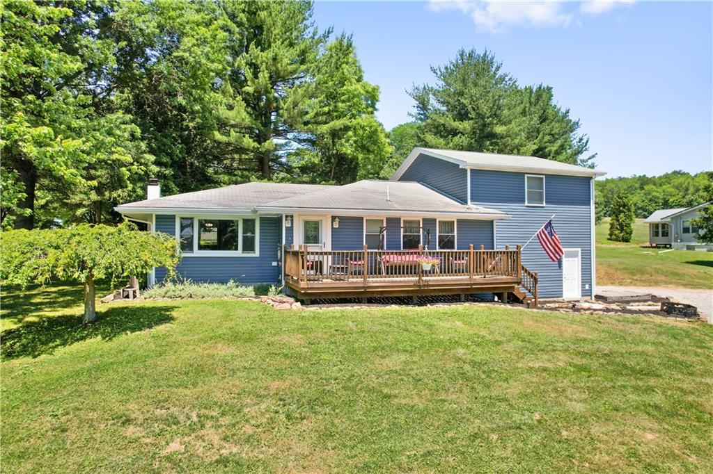 103 Stone Road Dawson, PA 15428 - Photo 1 of 25 a front view of a house with swimming pool