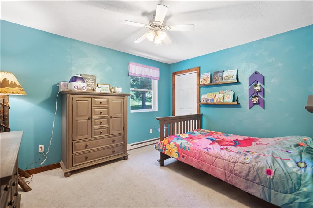 103 Stone Road Dawson, PA 15428 - Photo 16 of 25 a bedroom with two beds and a dresser