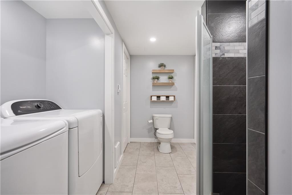 103 Stone Road Dawson, PA 15428 - Photo 20 of 25 a bathroom with a toilet and a shower