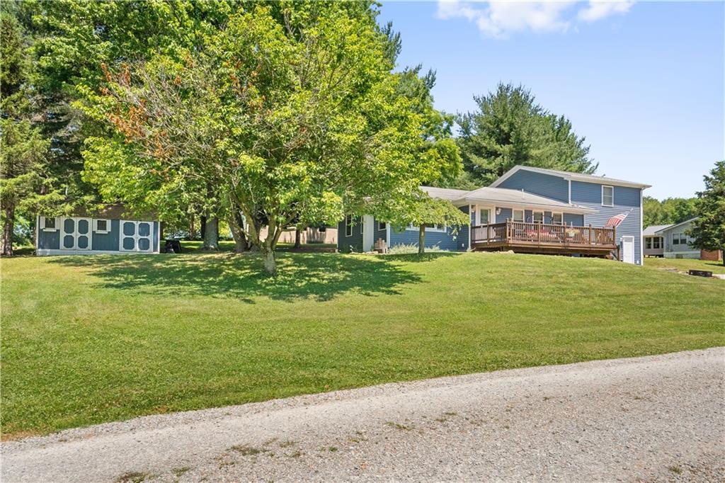103 Stone Road Dawson, PA 15428 - Photo 22 of 25 a view of a house with a big yard
