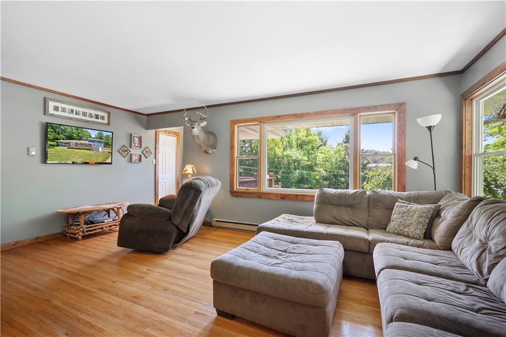 103 Stone Road Dawson, PA 15428 - Photo 4 of 25 a living room with furniture and a large window