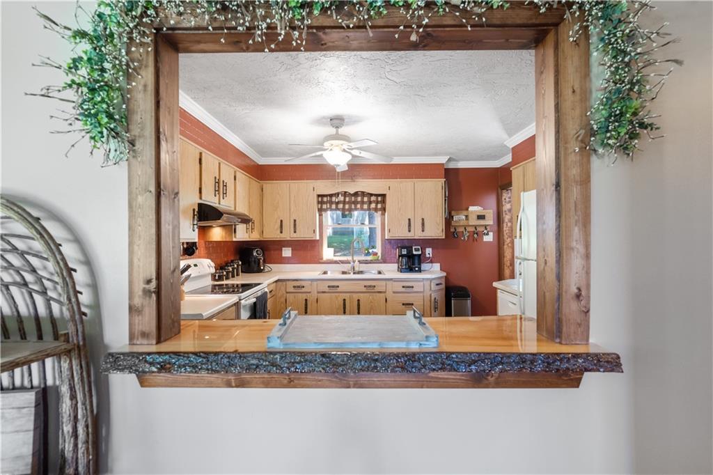 103 Stone Road Dawson, PA 15428 - Photo 6 of 25 a view of a living room and kitchen counter