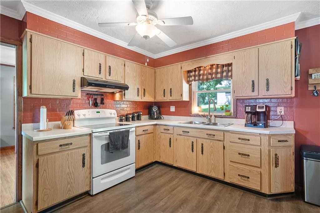 103 Stone Road Dawson, PA 15428 - Photo 10 of 25 a kitchen with a sink cabinets and window