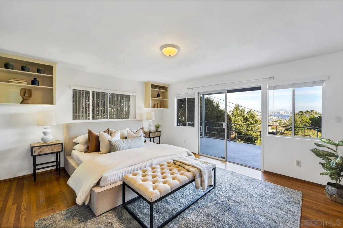 1141 Akron Street San Diego, CA 92106 - Photo 28 of 44 a bedroom with a bed and large window