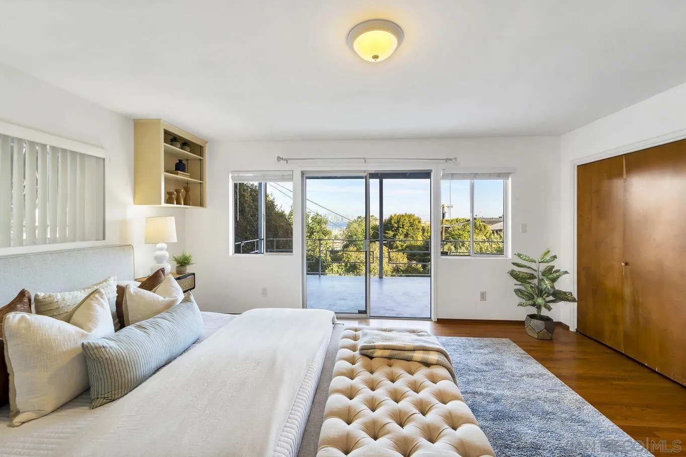 1141 Akron Street San Diego, CA 92106 - Photo 29 of 44 a bedroom with a bed and a window