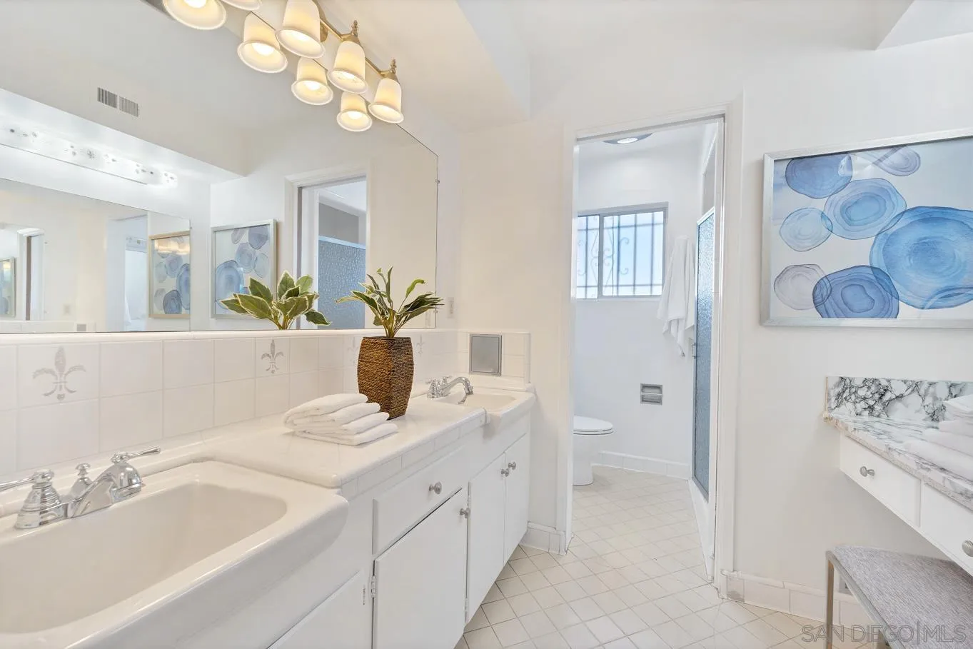 1141 Akron Street San Diego, CA 92106 - Photo 34 of 44 a bathroom with a double vanity sink mirror and vanity