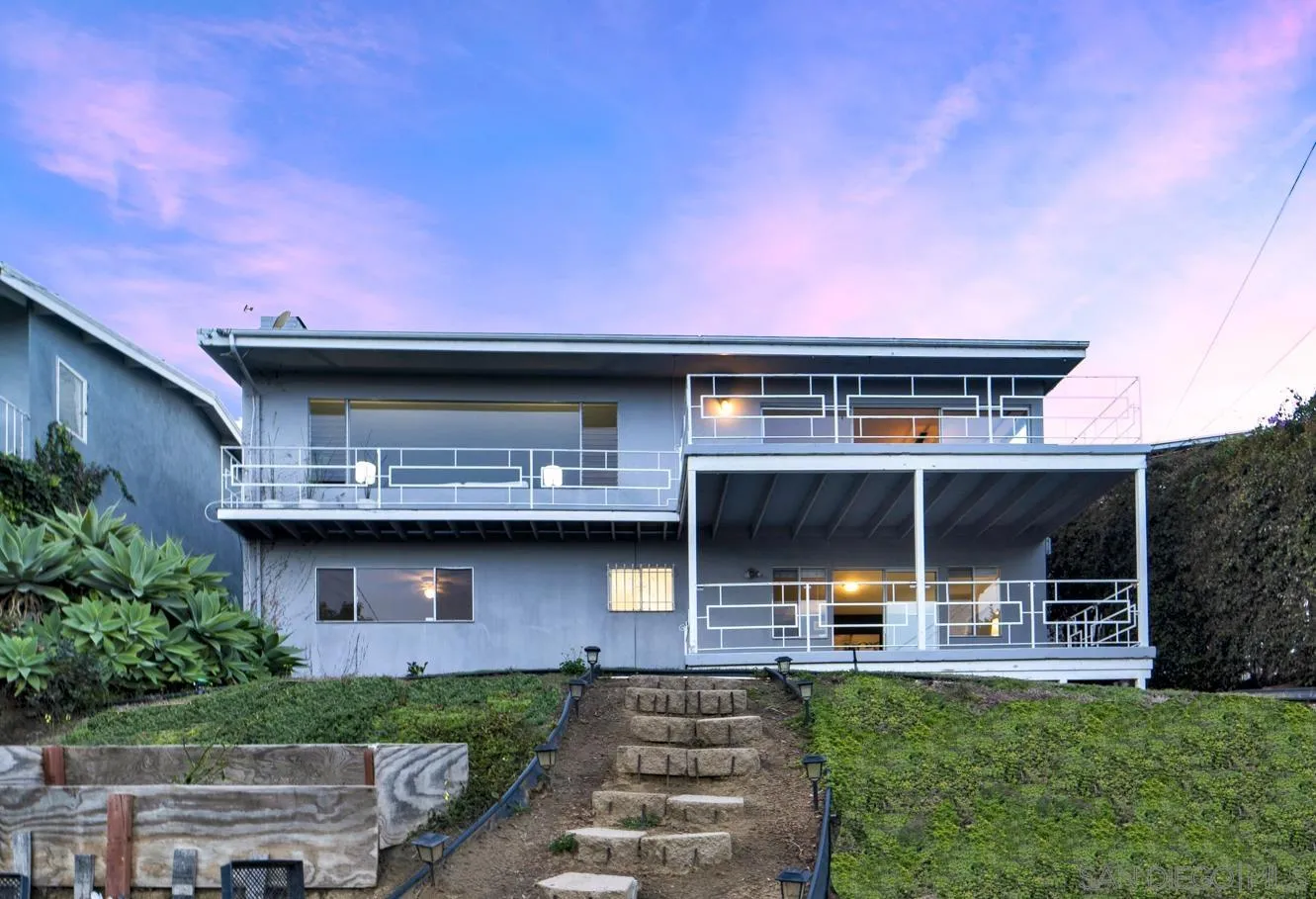 1141 Akron Street San Diego, CA 92106 - Photo 39 of 44 a front view of a house with a garden and plants