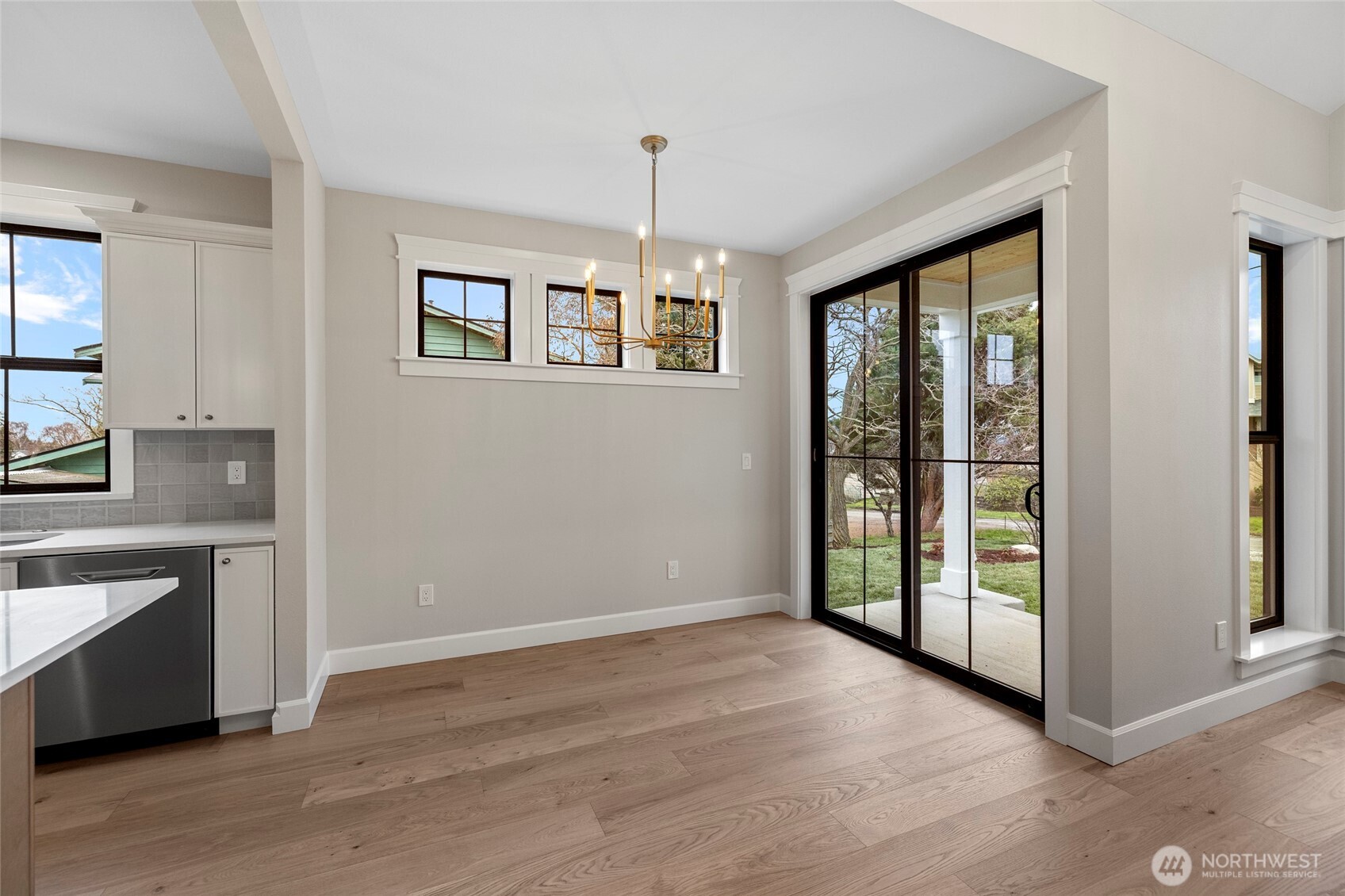 1211 King Street Anacortes, WA 98221 - Photo 11 of 40 a view of an empty room with a window and wooden floor