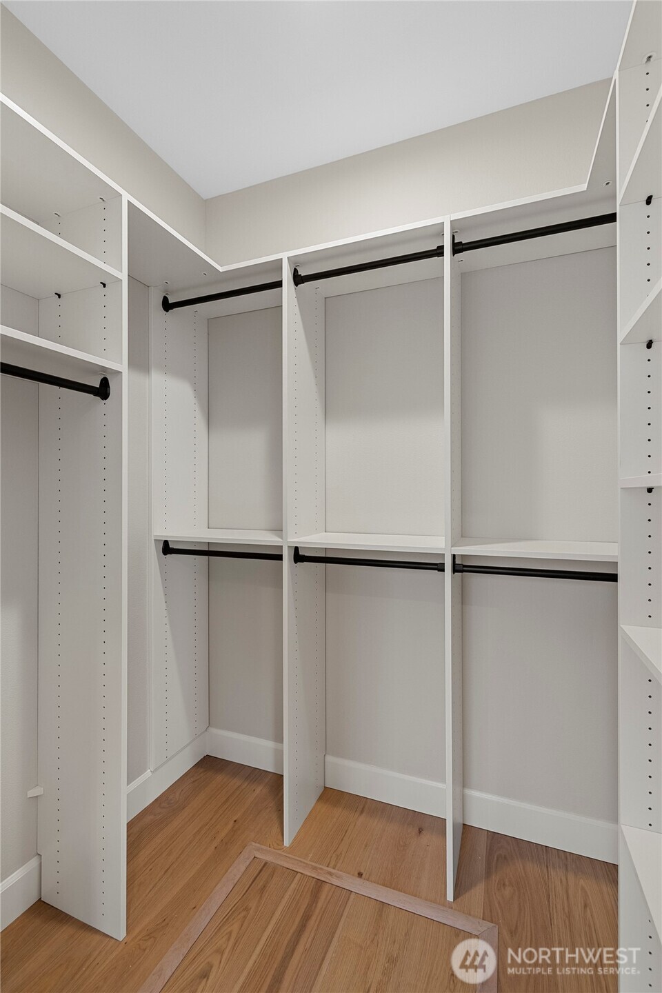 1211 King Street Anacortes, WA 98221 - Photo 24 of 40 a view of an empty walk in closet with empty racks