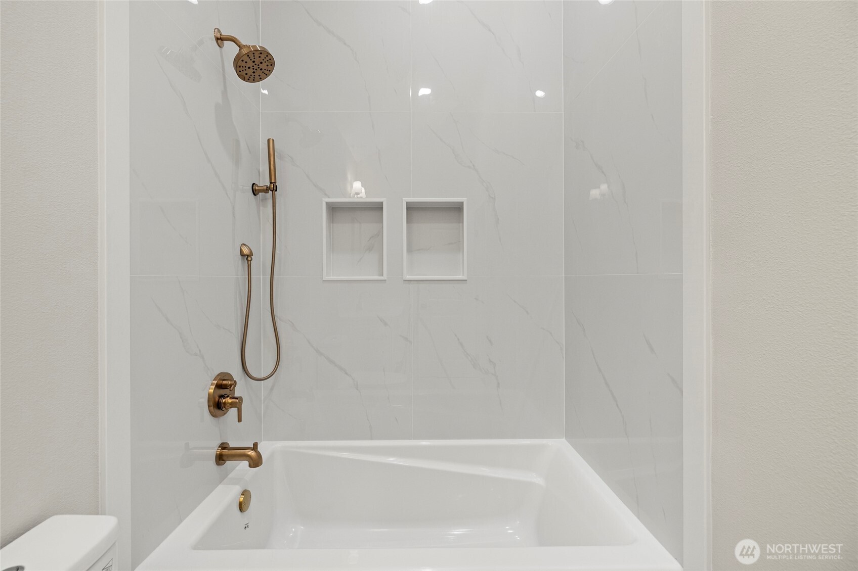 1211 King Street Anacortes, WA 98221 - Photo 32 of 40 a bathroom with a bathtub and a shower