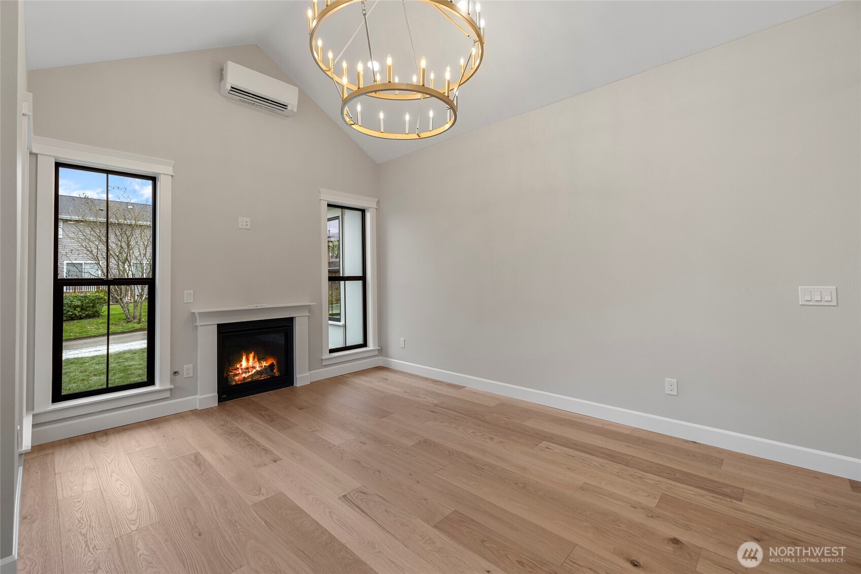 1211 King Street Anacortes, WA 98221 - Photo 10 of 40 an empty room with wooden floor fan and windows